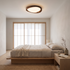 Noyer Model A walnut wood grain flush mount ceiling light in a Japandi bedroom