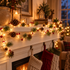 Pinewick pine cone mushroom Christmas string lights on a fireplace mantel