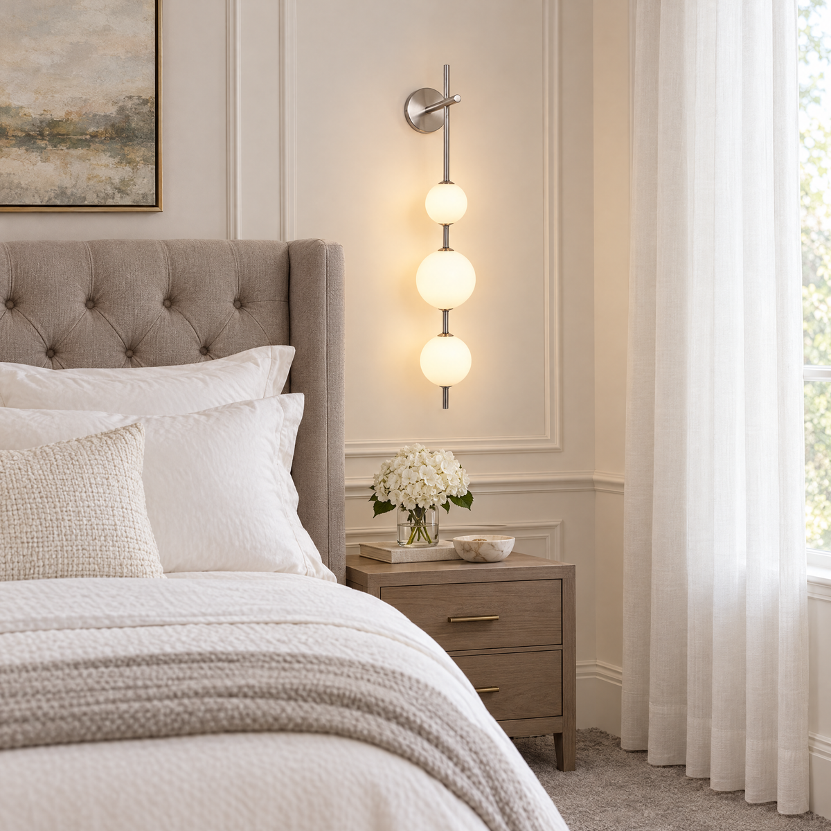 Kaskade globe wall sconce in nickel with 3 globes beside the bed in an Atlanta transitional bedroom