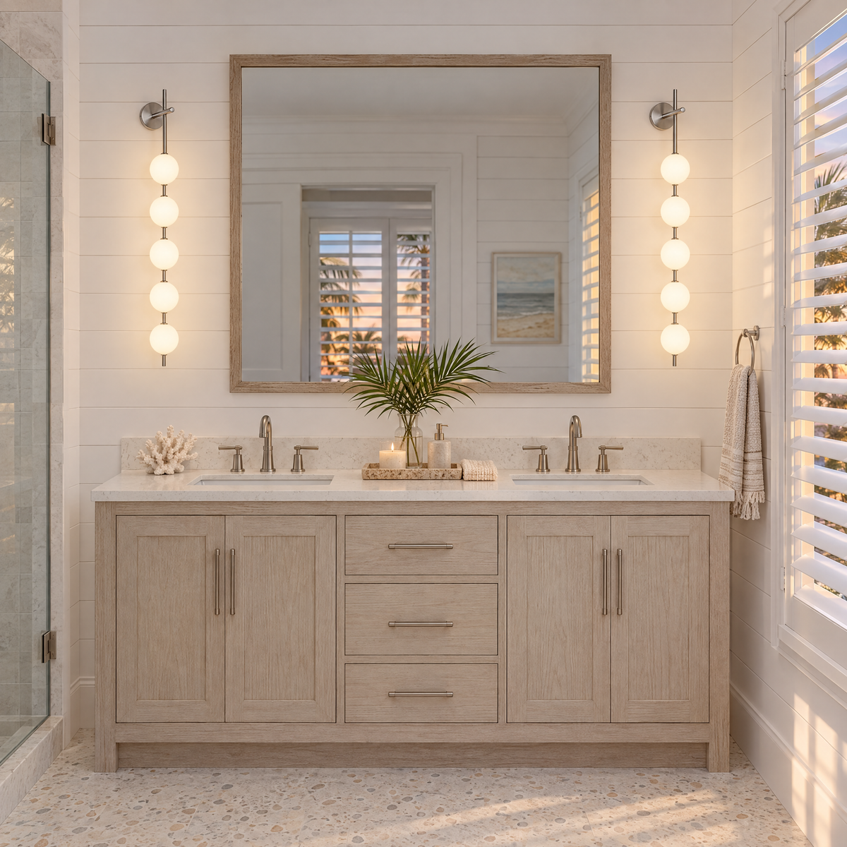 Kaskade globe wall sconce in nickel with 5 small globes by the vanity mirror in a Florida coastal bathroom