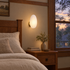 Opaline wall sconce in White & Gold, shape ∅8.6" x H13.7" in a Craftsman bungalow bedroom