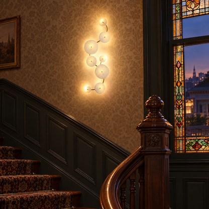 Florin ceramic petal wall sconce in white ceramic and gold, 8-petal vertical, in a Victorian San Francisco row house stairwell