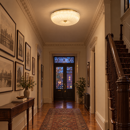 Givre ceiling light in frosted glass with gold trim in a Brooklyn brownstone hallway