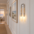 Palomino wall sconce in nickel & beige in a Hamptons shingle-style beach house hallway