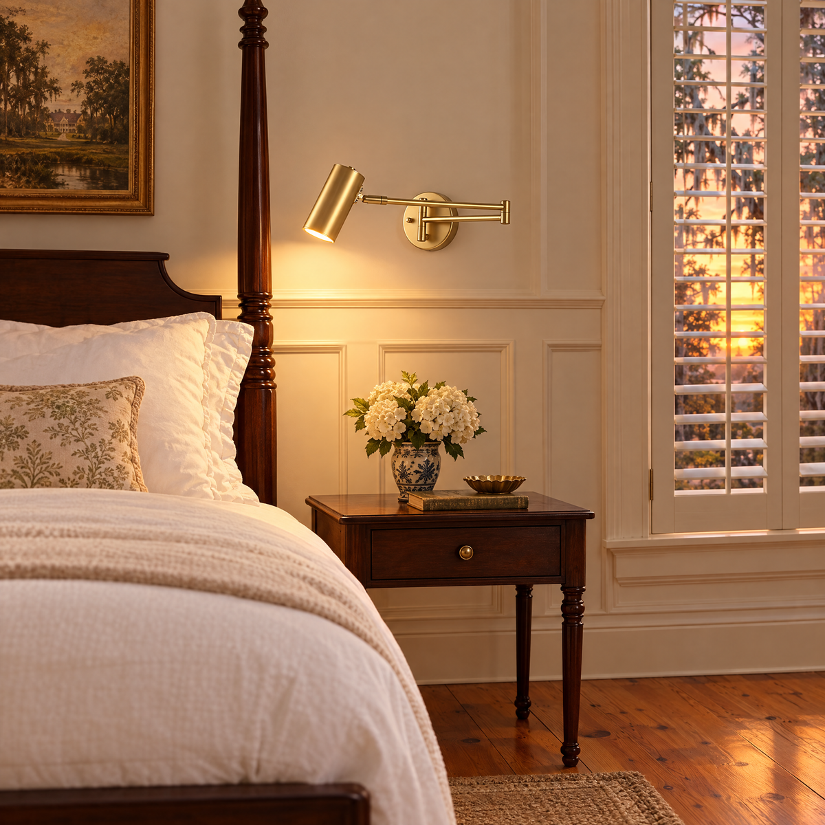 Tilda swing arm wall sconce in gold beside the bed in a Southern plantation-style bedroom