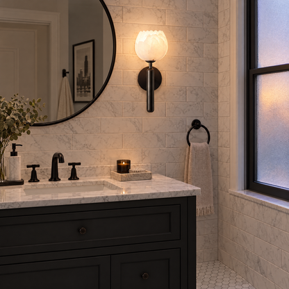 Mian alabaster flower wall sconce in black above the vanity in a Chicago greystone bathroom