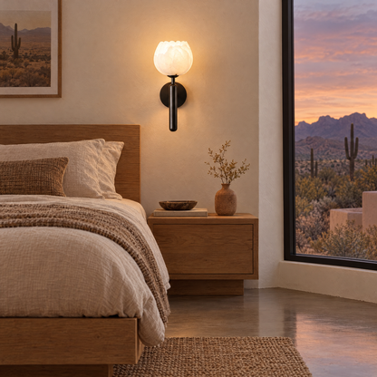 Mian alabaster flower wall sconce in black beside the bed in an Arizona desert modern bedroom