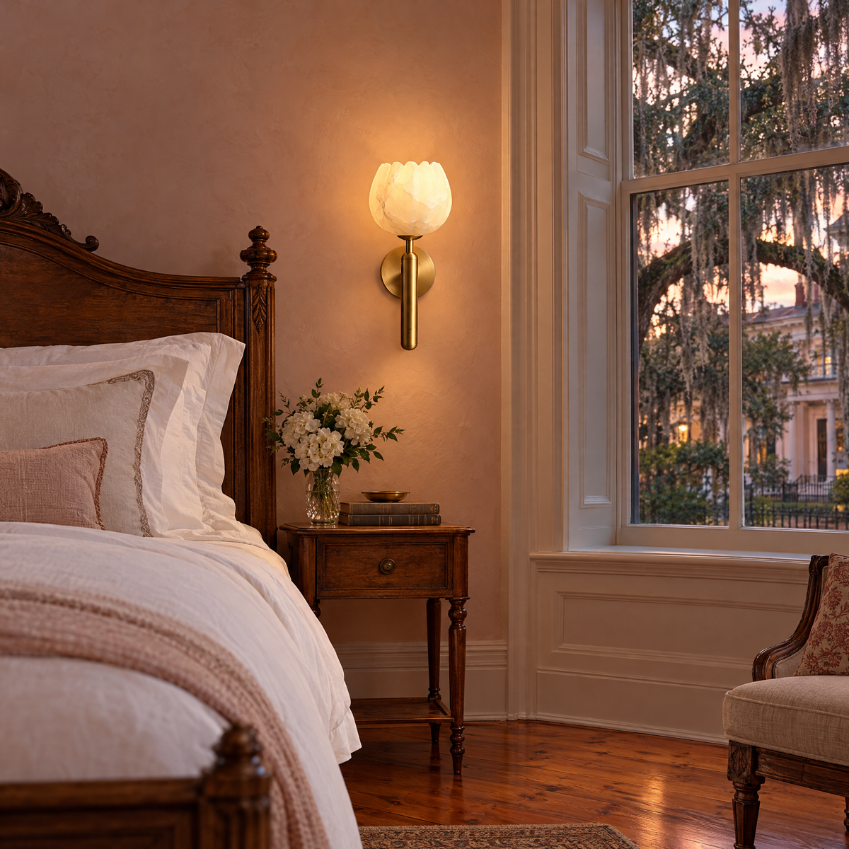 Mian alabaster flower wall sconce in brass beside the bed in a Savannah historic bedroom