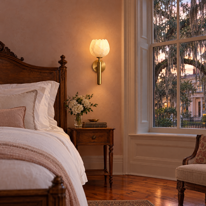 Mian alabaster flower wall sconce in brass beside the bed in a Savannah historic bedroom