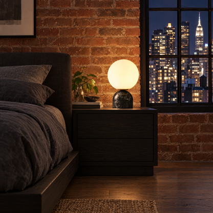 Sylas table lamp in black marble in a Manhattan loft bedroom