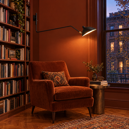 Rivoli swing arm wall sconce in Black, single arm in a Brooklyn brownstone reading nook