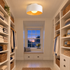 Lumosphere ceiling light in white & wood grain in a Cape Cod cottage walk-in closet