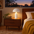 Dorsey mushroom table lamp in gloss white in a mid-century ranch bedroom