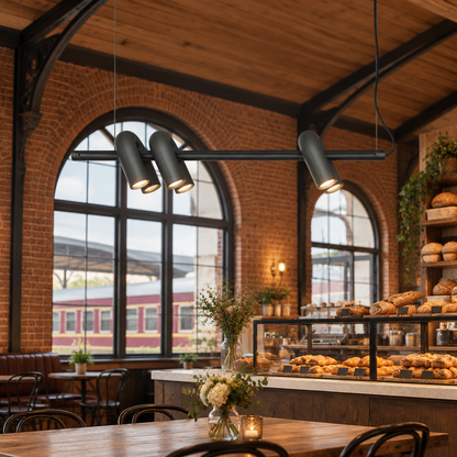 Zuri Modern LED Chandelier, 3 Lights Black, in a bakery cafe in a renovated American train depot