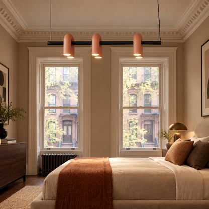 Zuri Modern LED Chandelier, 3 Lights Orange, in an East Coast brownstone bedroom with tall sash windows and crown molding