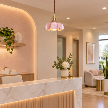 Hyacinth Pleated Glass Pendant Light, 1 Light Brass and Pink, in a medical spa reception area in a suburban office park