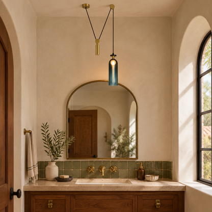 Kubik Geometric Modular Chandelier, Section C Gold Blue, in a Southern California Spanish bungalow bathroom with a vanity and arched mirror