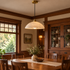 Dahlia Alabaster Dome Pendant Light, Cable mount, brass and white alabaster, in a craftsman bungalow dining room with wood trim and built-in cabinets