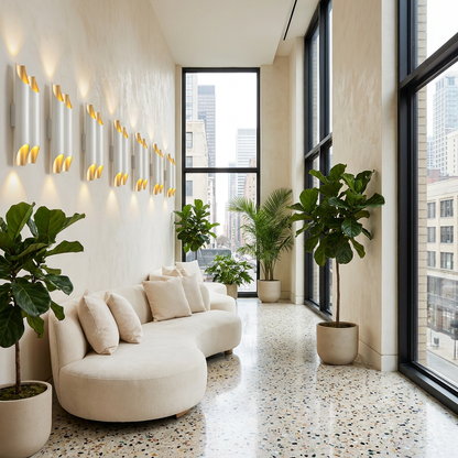 Solenne large double white and gold wall sconces in a boutique hotel lobby