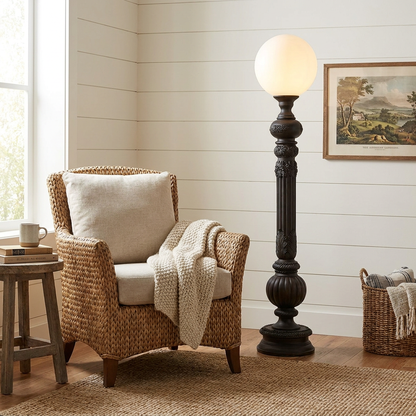 Corinthe ebony floor lamp in a modern farmhouse reading corner with a woven armchair