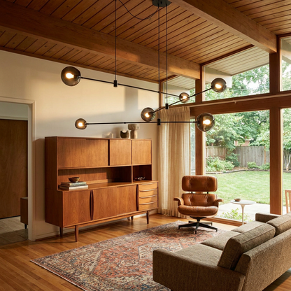 Equilia 6 heads chandelier in the living room of a mid-century modern house with high ceilings