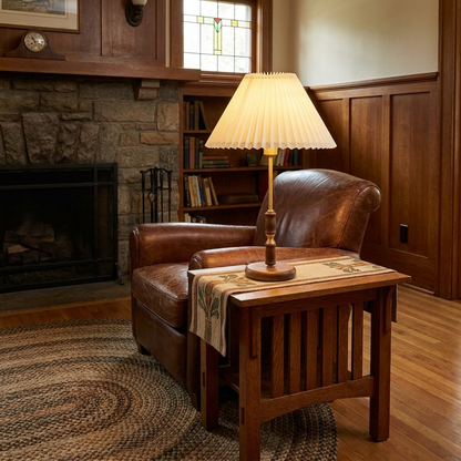Elodie table lamp on a side table next to a leather sofa in a craftsman living room