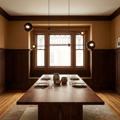 Equilia 4 heads chandelier above a walnut dining table in an American craftsman dining room with wainscoting
