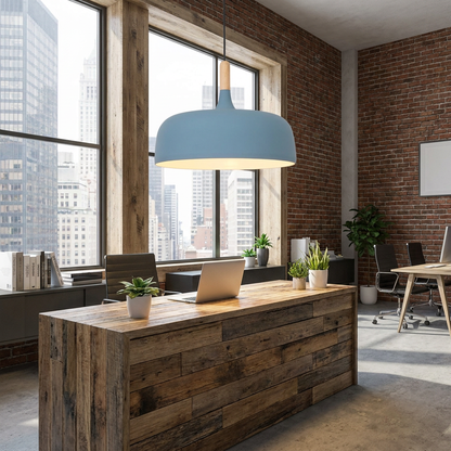 Noisette blue pendant light over the reception desk of a creative office with city buildings outside