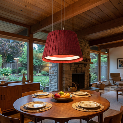 Calma red pendant light above the dining table of a mid-century ranch home