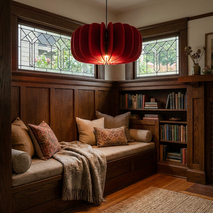 Lamelle disc red pendant light above a reading nook bench in a craftsman bungalow