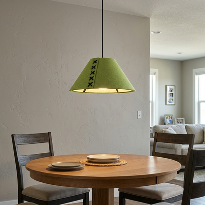 Feliciane apple green pendant light above a round oak dining table in a transitional suburban home