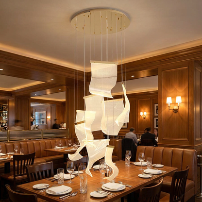 Cirrane 8 heads gold chandelier above the dining area of a fine dining restaurant