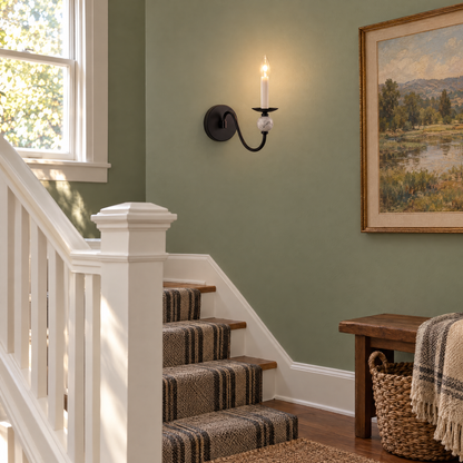 Brisa marble ball wall sconce in Matte Black on a Craftsman home stair landing