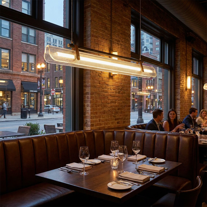 Talvi linear LED chandelier over a booth in an upscale restaurant