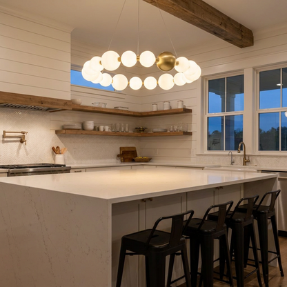 Coralyn round ring LED chandelier over a kitchen island in a modern farmhouse