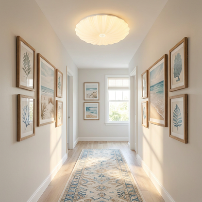 Conque white acrylic scalloped shell shaped round LED flush mount ceiling light in a hallway