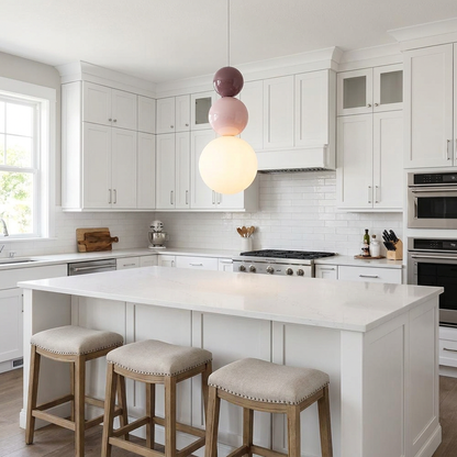 Trilla three ball acrylic pendant light over a kitchen island in a suburban home
