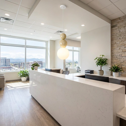 Trilla three ball acrylic pendant light over a reception desk