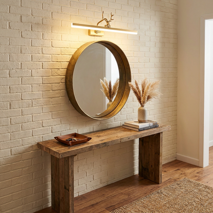 Cervo gold linear LED wall lamp above an entryway mirror