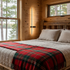 Rigo slim vertical black linear LED wall sconce in a guest bedroom of a lake house