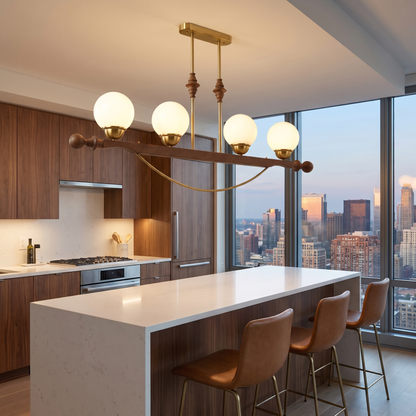 Verdane walnut and gold linear chandelier over an apartment kitchen island