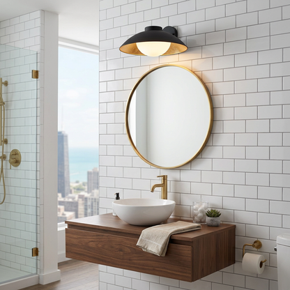 Ombrelle Dome Light in Black &amp; Gold above a bathroom vanity mirror