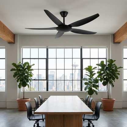 Noemi matte black ceiling fan above a worktable in a modern office