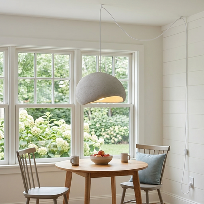 Thessaly cloud plug-in swag pendant light in Grey over a breakfast table in a farmhouse kitchen nook