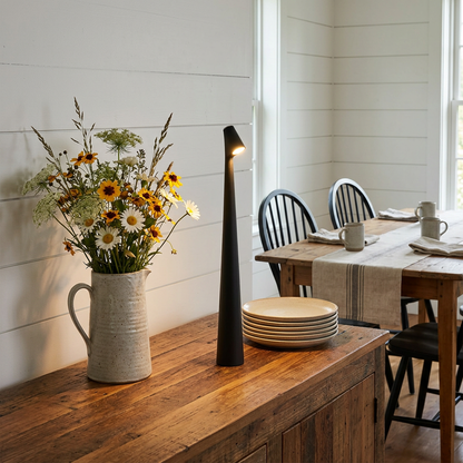Amaryn cordless cone table lamp in Black on a farmhouse dining sideboard