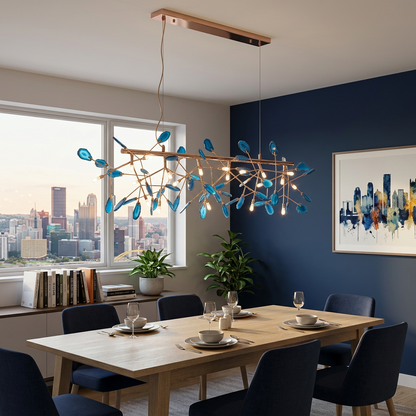 Calliste 24-head linear blue agate rose gold chandelier over a dining table in a Pittsburgh apartment