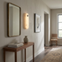 Aquila alabaster capsule wall sconce in a suburban hallway in Charlotte