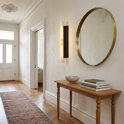 Amelie black blade alabaster wall sconce in an apartment entry hallway