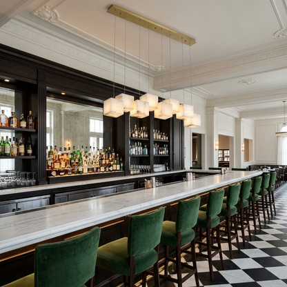 Ariane 8-light linear alabaster cube chandelier in gold over a New Orleans restaurant bar