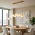 Ariane 6-light linear alabaster cube chandelier in gold over a Kansas City apartment dining table